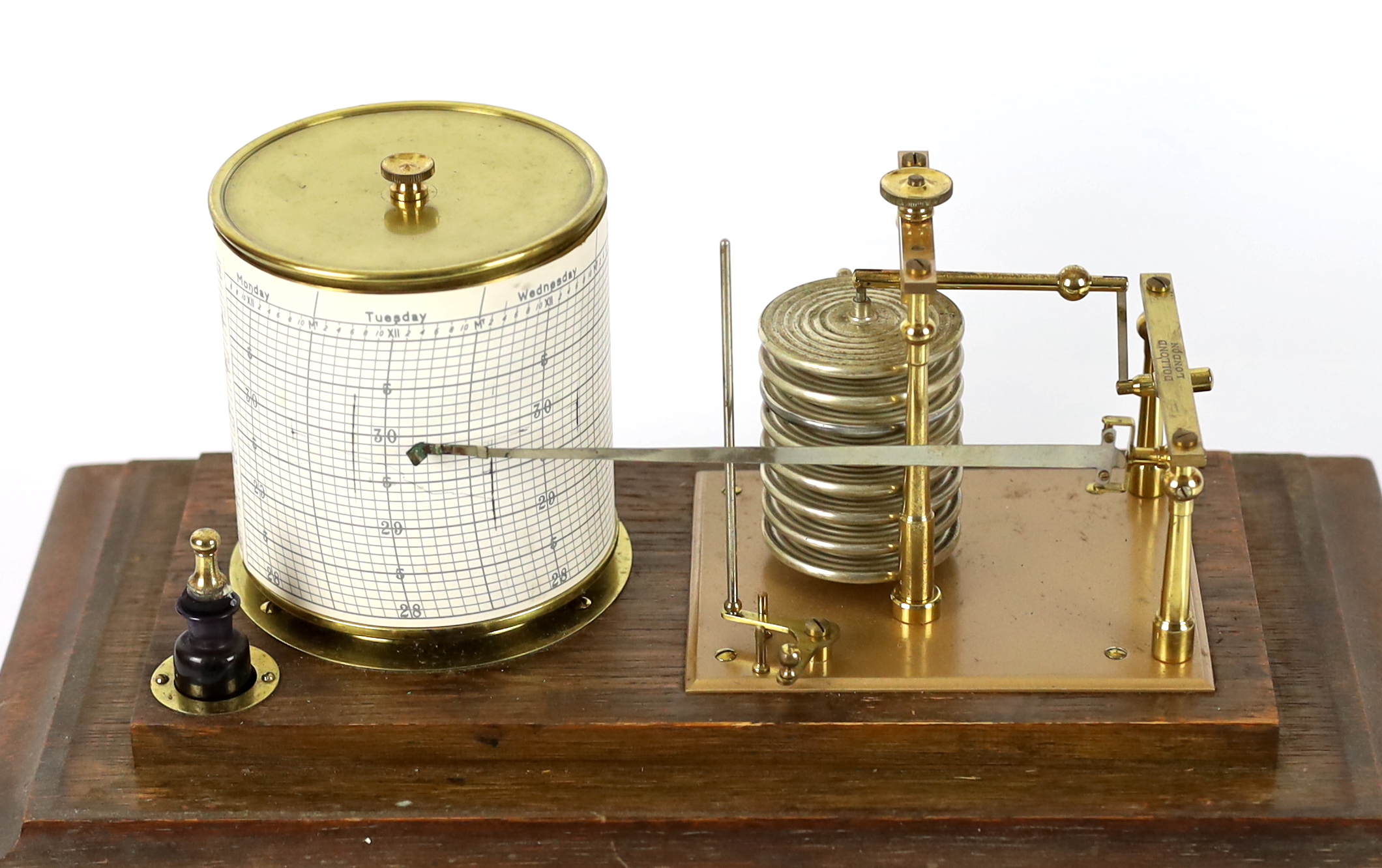 A barograph by Dollond in an oak case with bevelled glass panels and incorporating an ink bottle and a drawer with spare graph papers, 36.5cm x 21.5cm